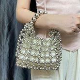 High Sense Minority Simple Elegant Hollow Out Cutout Handmade Beaded Dumpling Bag Retro Woven Handbag