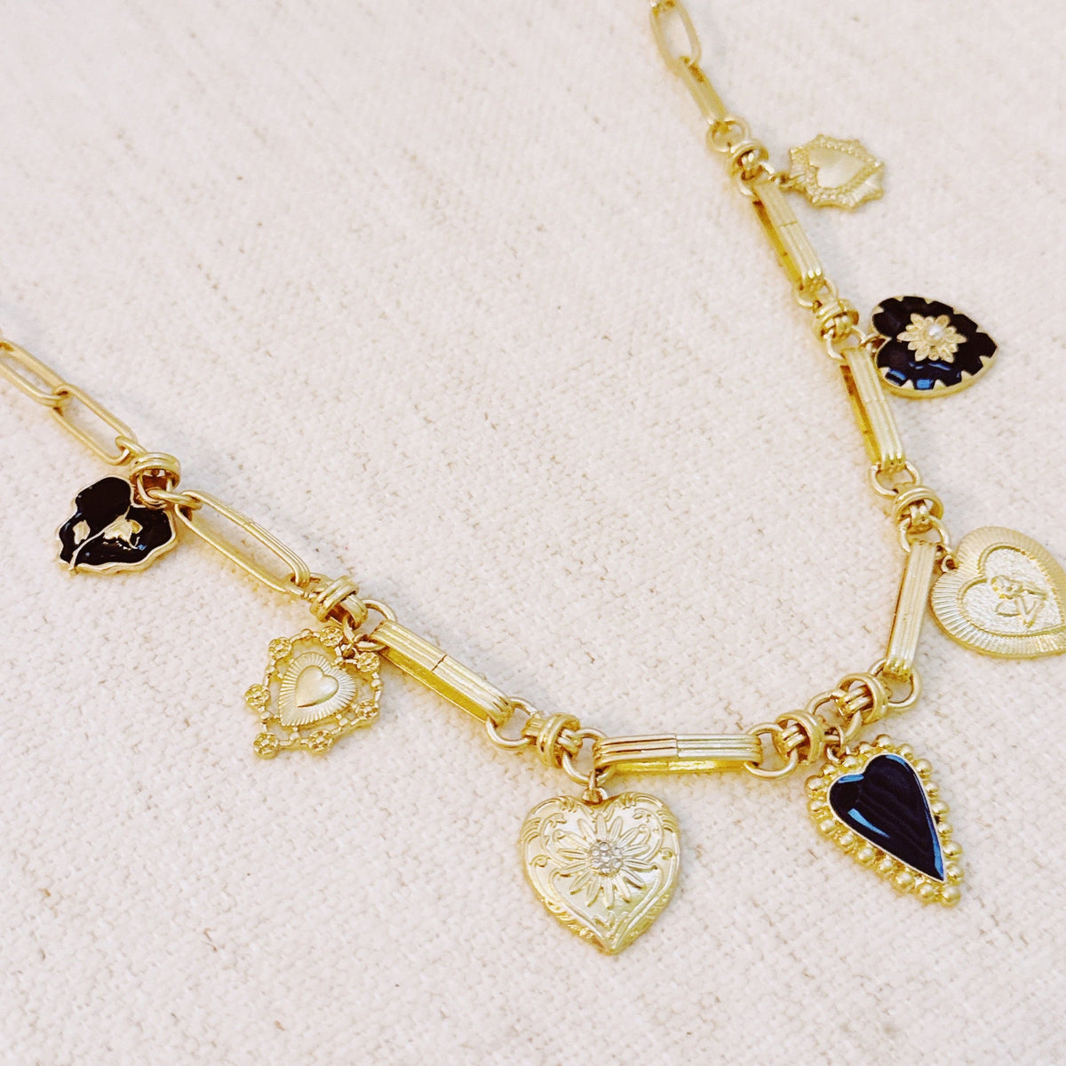 Mixed Heart Charm Necklace – Gold Chain with Elegant Black and Gold Heart Pendants