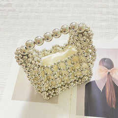 High Sense Minority Simple Elegant Hollow Out Cutout Handmade Beaded Dumpling Bag Retro Woven Handbag